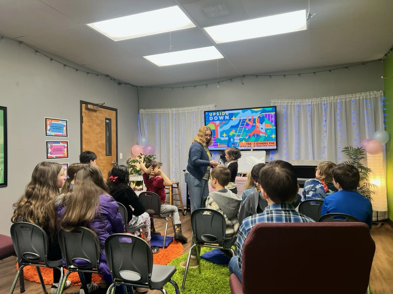Children learning together with a teacher in Kids Church