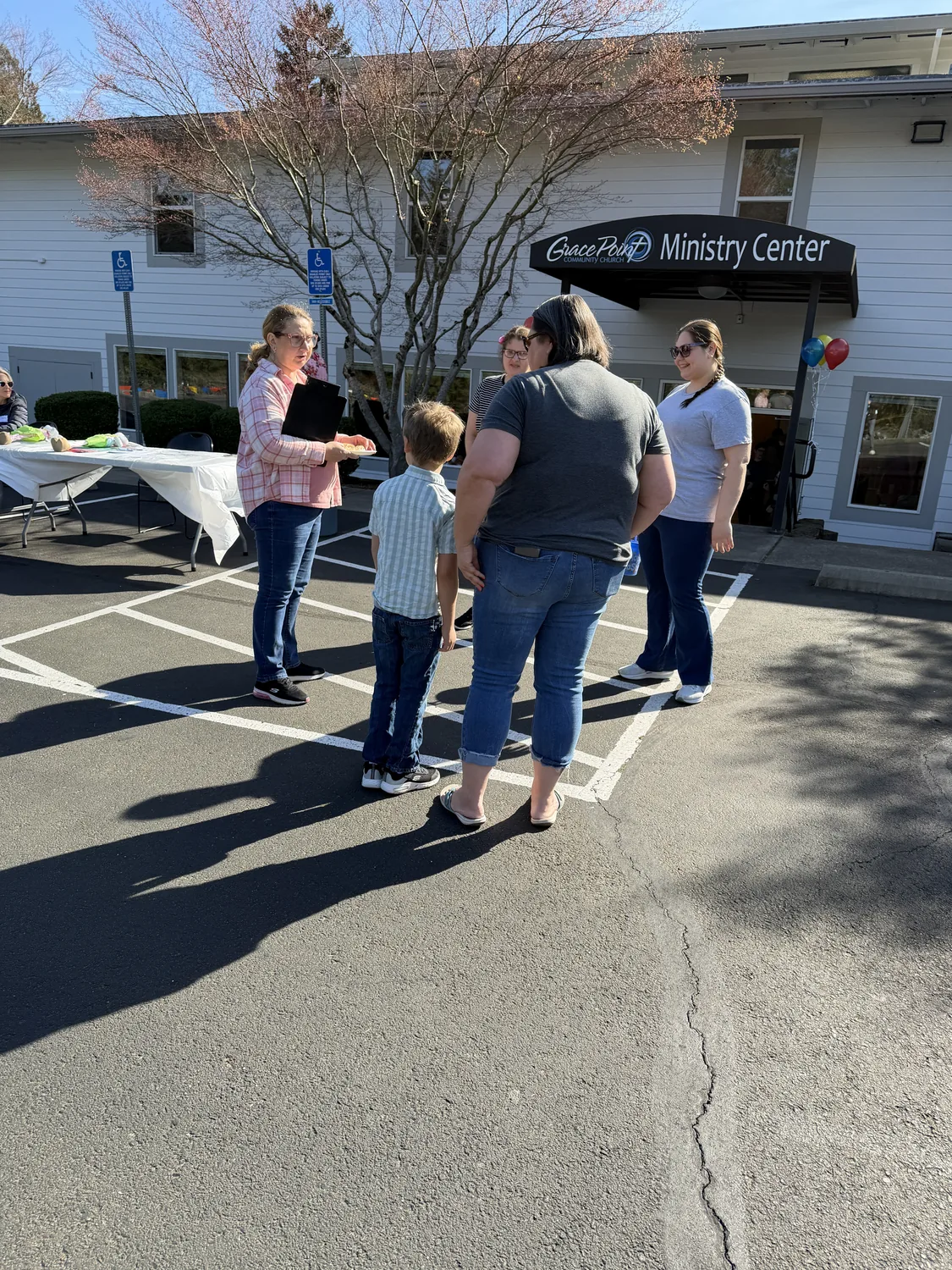 People greeting one another outside the Grace Point Ministry Center